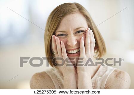 Stock Photography - Portrait of mid adult woman smiling. Fotosearch