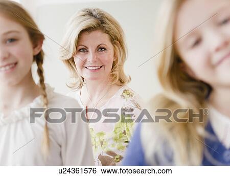 Portrait of mother and daughters (8-11) View Large Photo Image Stock Photograph - Portrait of mother and daughters (8-11). Fotosearch