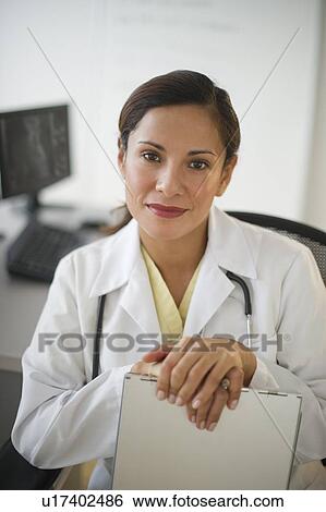Portrait of smiling female doctor View Large Photo Image Stock Photograph - Portrait of smiling female doctor . Fotosearch