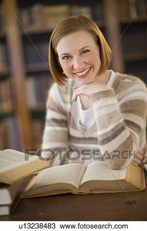 Portrait of woman in library View Large Photo Image Stock Image - Portrait of woman in library. Fotosearch