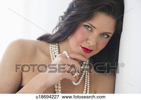 Portrait of young woman wearing pearls View Large Photo Image Stock Photo - Portrait of young woman wearing pearls. Fotosearch
