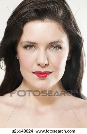 Portrait of young woman wearing red lipstick View Large Photo Image Picture - Portrait of young woman wearing red lipstick. Fotosearch