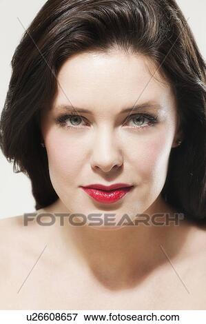 Portrait of young woman wearing red lipstick View Large Photo Image Stock Photo - Portrait of young woman wearing red lipstick. Fotosearch