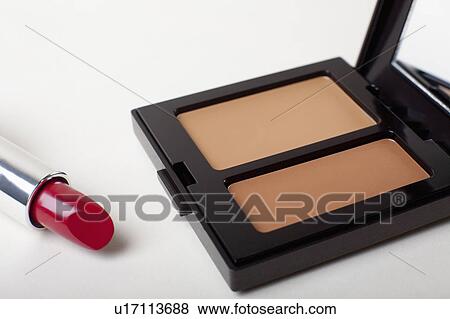 Stock Photo - Powder compact with red lipstick. Fotosearch