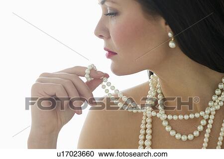 Profile of young woman wearing pearls View Large Photo Image Stock Image - Profile of young woman wearing pearls. Fotosearch