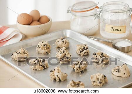 Stock Photo - Raw cookies on baking tray. Fotosearch