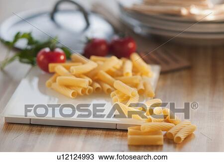 Raw pasta on weight scale View Large Photo Image Stock Image - Raw pasta on weight scale. Fotosearch