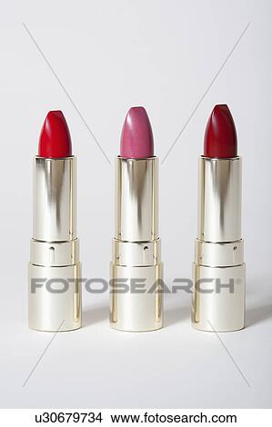 Picture - Red and pink lipsticks. Fotosearch