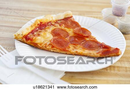 Slice of pepperoni pizza on plate View Large Photo Image Stock Image - Slice of pepperoni pizza on plate. Fotosearch