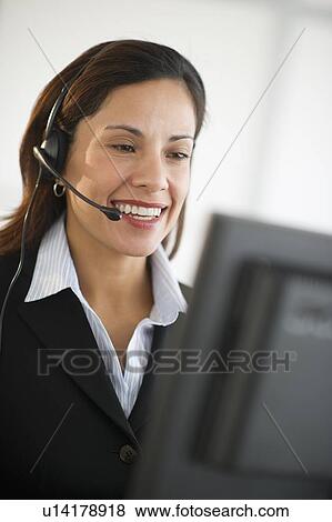 Smiling female customer service representative with headset View Large Photo Image Stock Photo - Smiling female customer service representative with headset. Fotosearch