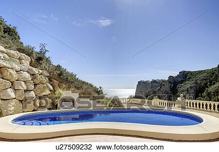 Stock Image - Spain, Costa Blanca, Hotel swimming pool. Fotosearch