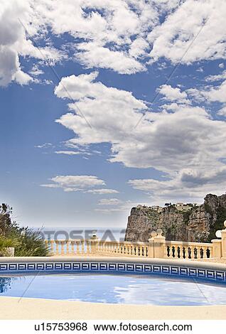 Stock Photo - Spain, Costa Blanca, Hotel swimming pool. Fotosearch