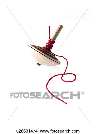 Picture - Spinning top on white background. Fotosearch