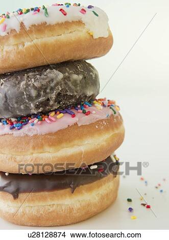 Picture - Stack of donuts, close-up. Fotosearch
