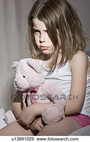 Studio portrait of sad girl (6-7) with pink teddy bear View Large Photo Image Stock Photo - Studio portrait of sad girl (6-7) with pink teddy bear. Fotosearch