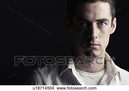 Picture - Studio portrait of young man. Fotosearch