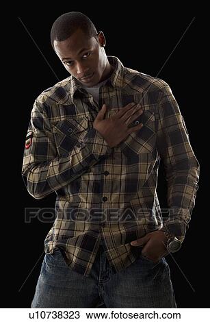 Studio portrait of young man View Large Photo Image Stock Image - Studio portrait of young man. Fotosearch