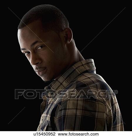 Studio portrait of young man View Large Photo Image Stock Image - Studio portrait of young man. Fotosearch