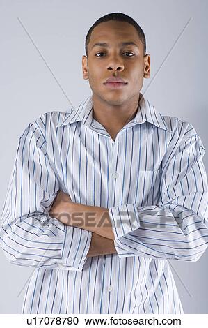 Stock Image - Studio portrait of young man . Fotosearch