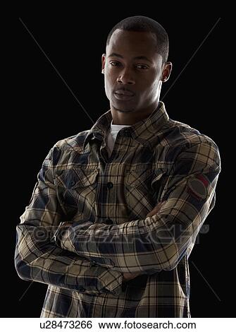 Studio portrait of young man View Large Photo Image Stock Photograph - Studio portrait of young man. Fotosearch