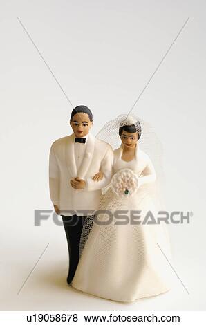 Studio shot of bride and groom figurines View Large Photo Image Stock Photo - Studio shot of bride and groom figurines. Fotosearch