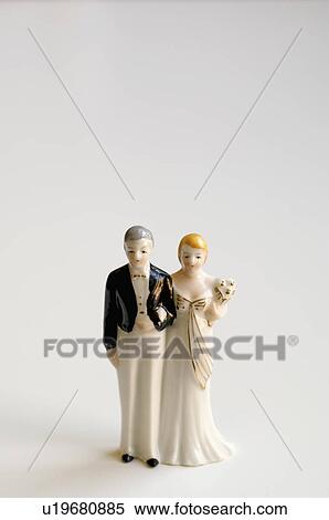 Stock Photography - Studio shot of bride and groom figurines. Fotosearch