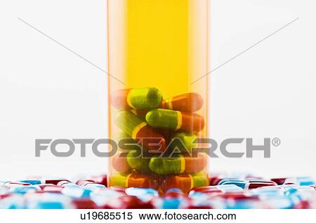 Stock Photography - Studio shot of capsules and pill bottle. Fotosearch