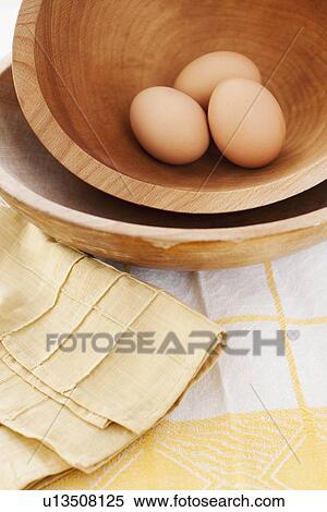 Studio shot of eggs in wooden bowl View Large Photo Image Stock Photography - Studio shot of eggs in wooden bowl. Fotosearch