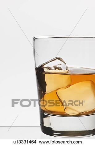 Picture - Studio shot of glass of whiskey. Fotosearch