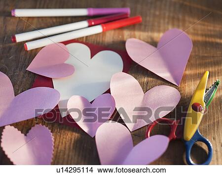 Picture - Studio shot of heart-shaped paper cutouts. Fotosearch
