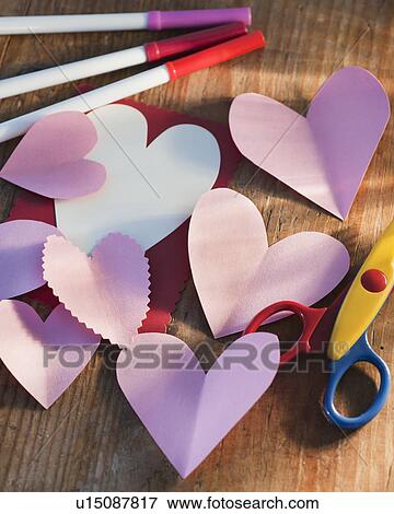 Studio shot of heart-shaped paper cutouts View Large Photo Image Stock Photo - Studio shot of heart-shaped paper cutouts. Fotosearch