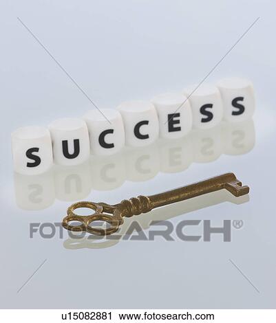 Stock Image - Studio shot of key and dice spelling out success. Fotosearch