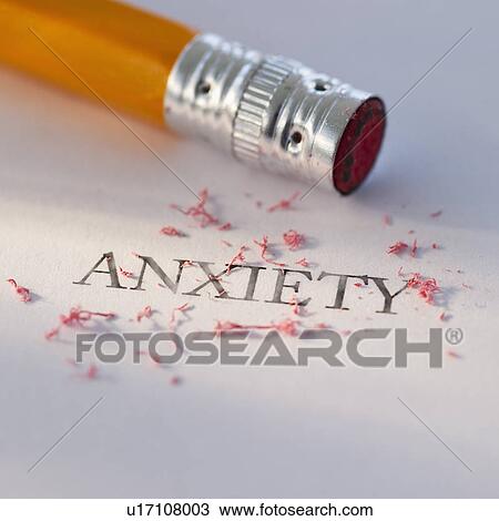 Stock Image - Studio shot of pencil erasing the word anxiety from piece of paper. Fotosearch