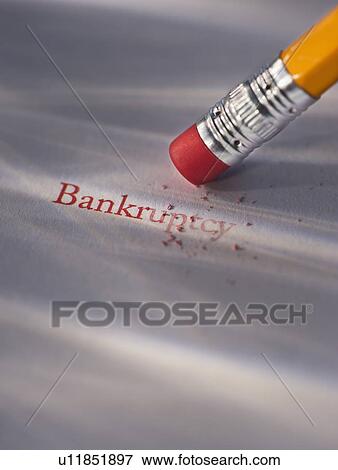 Stock Photo - Studio shot of pencil erasing the word bankruptcy from piece of paper. Fotosearch