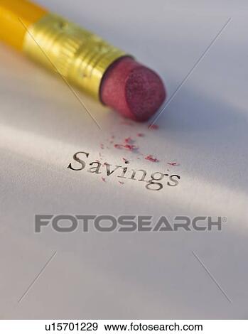 Stock Photo - Studio shot of pencil erasing the word savings from piece of paper. Fotosearch