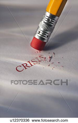 Stock Photograph - Studio shot of pencil erasing the word crisis from piece of paper. Fotosearch