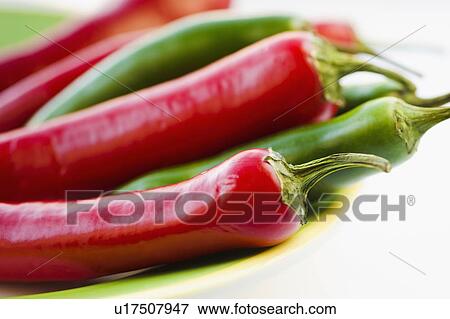 Studio shot of red and green Chili Peppers View Large Photo Image Stock Photo - Studio shot of red and green Chili Peppers. Fotosearch