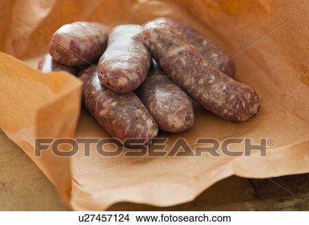 Studio shot of sausage wrapped in brown paper View Large Photo Image Picture - Studio shot of sausage wrapped in brown paper. Fotosearch