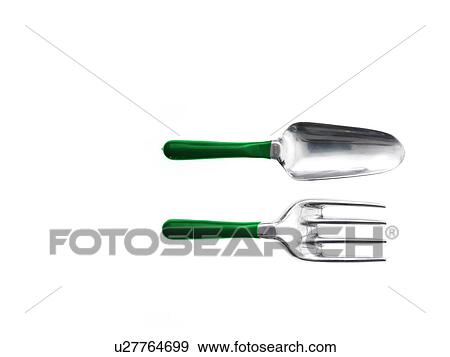 Stock Photo - Studio shot of spade and gardening fork. Fotosearch