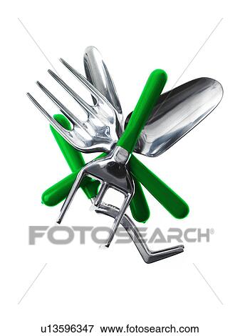 Stock Photo - Studio shot of spades and gardening forks. Fotosearch