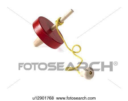 Stock Photo - Studio shot of spinning top. Fotosearch