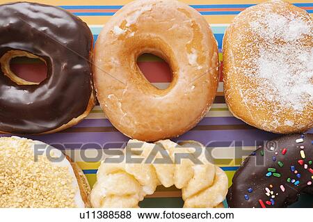 Studio shot of various donuts View Large Photo Image Stock Photo - Studio shot of various donuts. Fotosearch