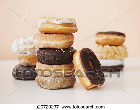 Studio shot of various donuts View Large Photo Image Stock Photo - Studio shot of various donuts. Fotosearch