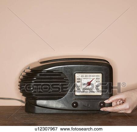 Stock Photo - Studio shot of woman working on computer. Fotosearch