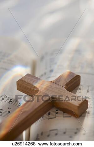 Stock Photo - Studio shot of wooden cross. Fotosearch