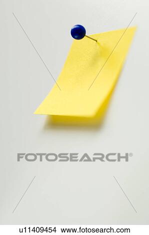Picture - Studio shot of yellow adhesive note. Fotosearch
