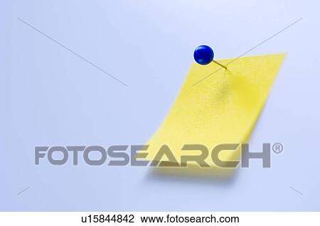 Stock Image - Studio shot of yellow adhesive note. Fotosearch