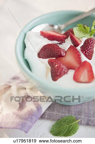 Studio shot of yogurt with strawberries View Large Photo Image Stock Photo - Studio shot of yogurt with strawberries. Fotosearch