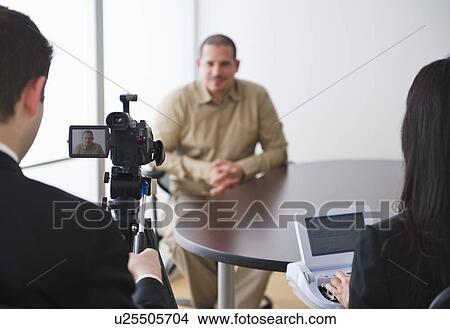 Picture - Testimony being videotaped. Fotosearch