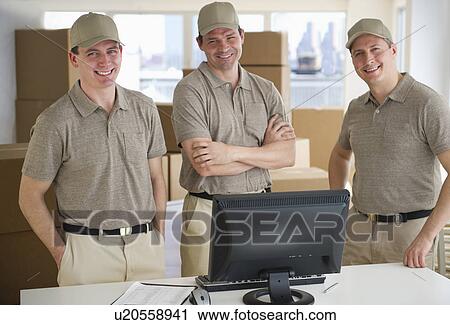 Three delivery warehouse workers View Large Photo Image Stock Image - Three delivery warehouse workers. Fotosearch